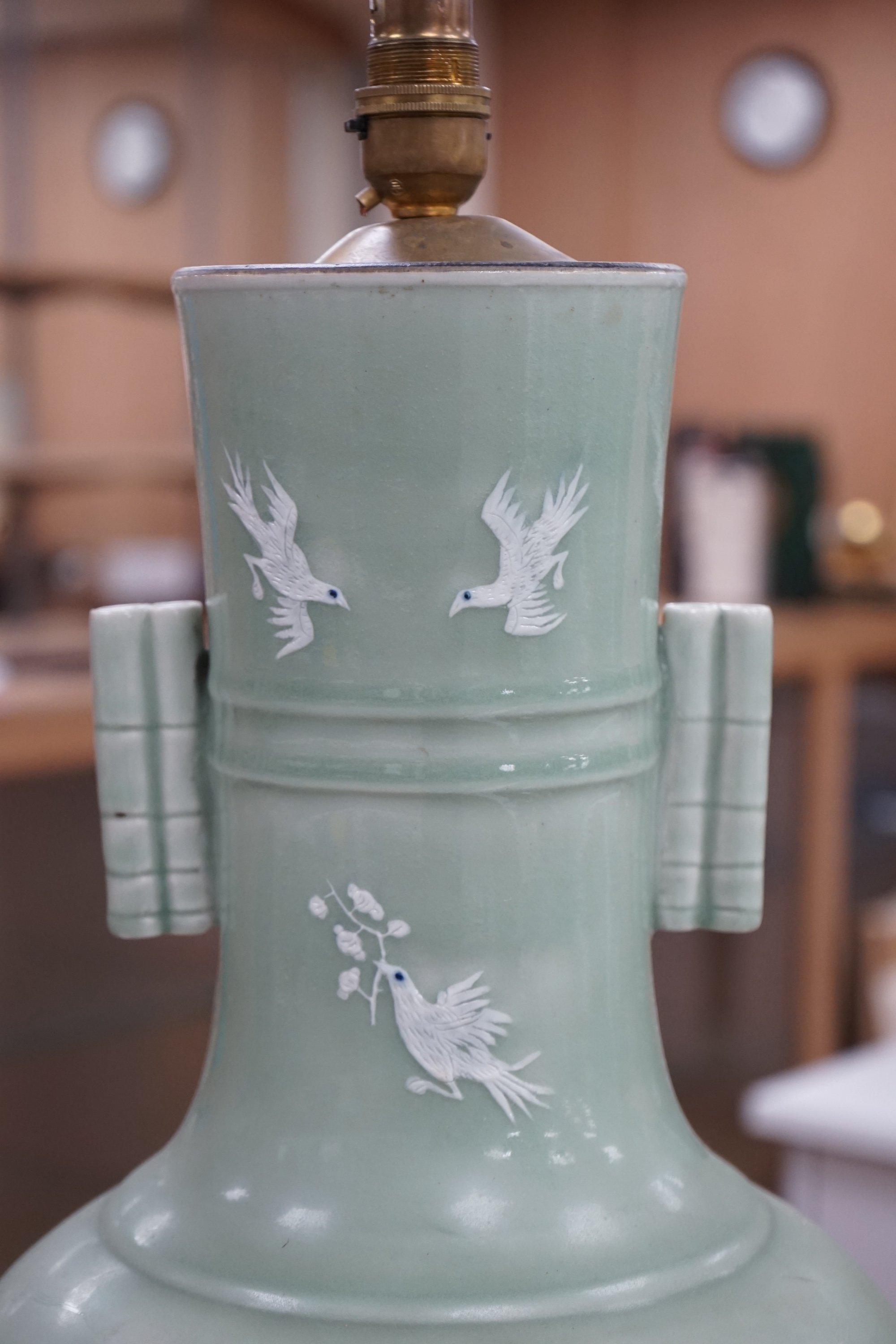 A large Chinese underglaze blue and slip decorated celadon ground vase, converted to a lamp, 61cm high. Condition - a crack 16cm down the side of the body